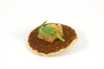 Mini pancake with caviar of pike
