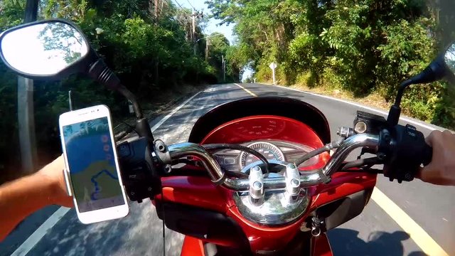 The biker travels along the roads of Asia. POV.  first person view 