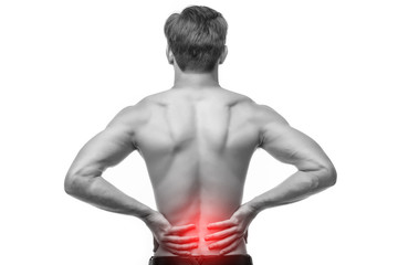 Fototapeta premium Close up of man rubbing his painful back. Pain relief, chiropractic concept