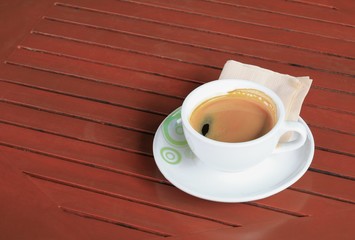 coffee cappuccino on the wood floor background