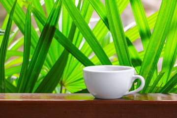 coffee cup  on  wood floor background select focus with shallow depth of field.