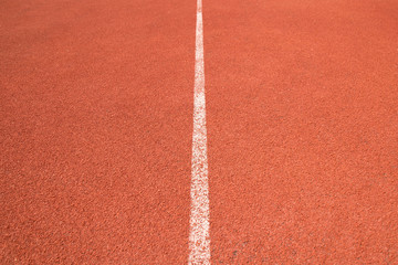 Close up perspective white line of Athletics track in sport stadium