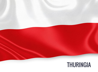 Flag of German state Thuringia waving on an isolated white background.