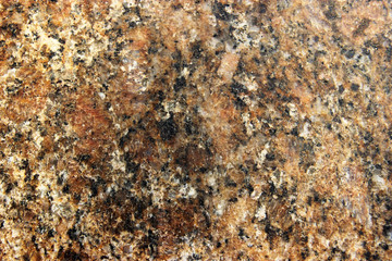 Stone Background of mottled granite igneous rock used for kitchen worktops etc