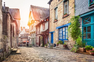 Gordijnen Charming street scene in an old town in Europe at sunset © JFL Photography