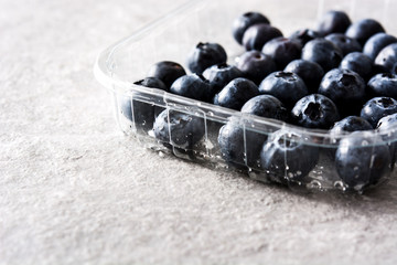 Blueberries in on gray stone
