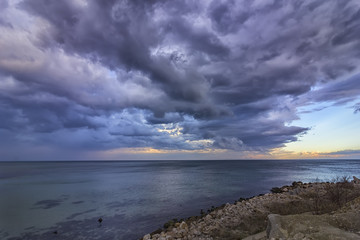 Exciting calm seascape with stormy clouds