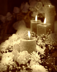 Candle on floral background