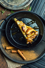 Apple pie with cinnamon. Dessert. The restaurant or cafe atmosphere. Vintage