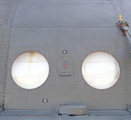metal surface of military aircraft with window