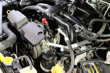  interweaving of pipes and hoses in modern automotive engine
