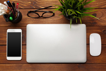 Laptop, notebook on work wooden desk