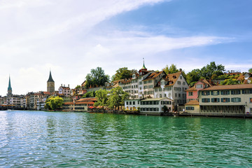 Fototapeta premium Limmat River quay and St Peter and Fraumunster Church Zurich