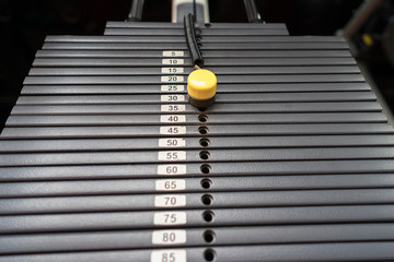 Black metallic or iron heavy plates stacked for sport, exercise, weight machine with kilogram and...