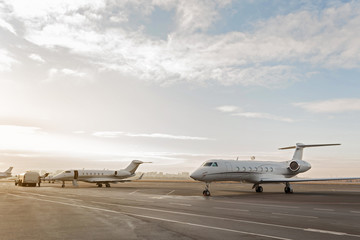 Fototapeta na wymiar Different passenger aircrafts situating at runway