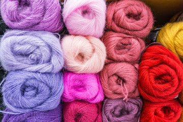 Closeup of colored mohair yarn for knitting, skeins in purple, pink,  blue, red, yellow,ect....