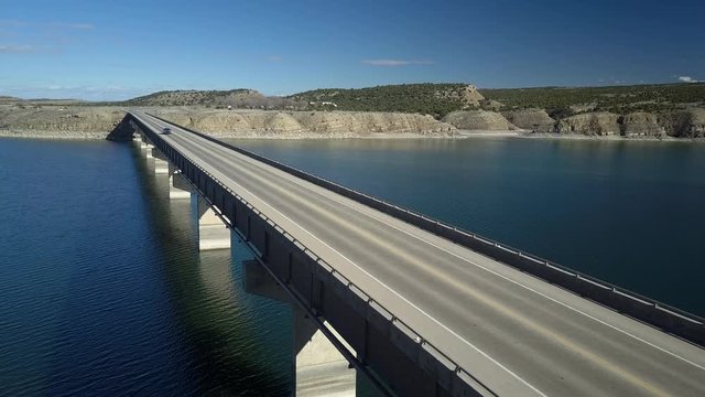Aerial pickup truck Starvation Reservoir bridge east Utah. State Park open year round for recreation, fishing and boating. Freedom Bridge near Duchesne Utah and the Uintah Basin.