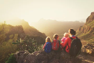 Wallpaper murals Canary Islands mother with three kids hiking in mountains