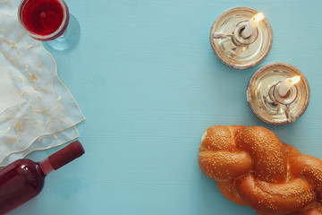 shabbat image. challah bread, shabbat wine and candles © tomertu