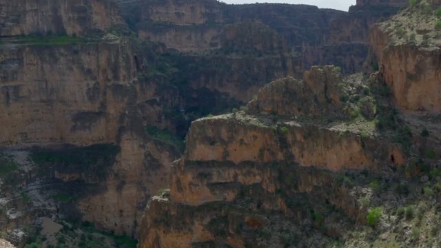 Panorama big  canyon of Iran in sunny day, rare vegetation on steep rocks