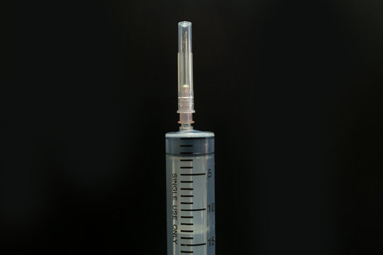  injection needle medical tool  in black background image closeup