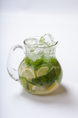 Summer lemonade with spices, ice, lemon and mint