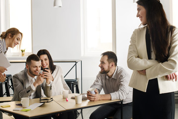 Group of creative young people in the office makes selfie