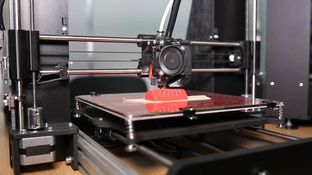 3d printer is typing 3d model of a red owl. The video is shot close-up. This video was shot using Canon 5d Mark 3. If you liked this video, rate it, please!