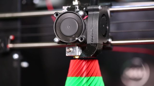3d printer prints a 3d model of a green-red vase. The video is shot close-up. This video was shot using Canon 5d Mark 3. If you liked this video, rate it, please!