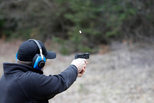 Man shooting handgun