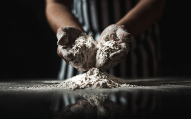 Male chef prepares a meal of flour