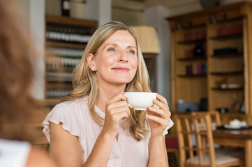 Woman thinking over coffee