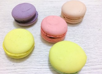 Bright couloured macaroons on a white background