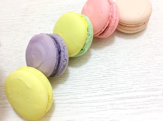 Bright couloured macaroons on a white background