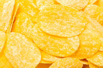 yellow potato chips isolated on white