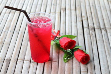 Red wine in plastic and rose glasses