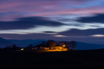 Farmhouse, Altopiano of Asiago, Province of Vicenza, Veneto, Italy. Farmhouses in the evening light.