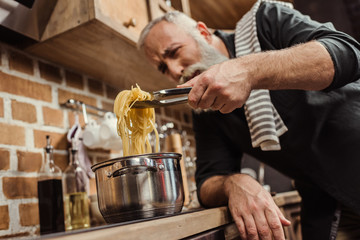 Man cooking spaghetti