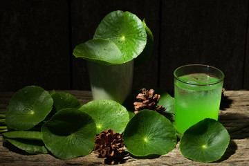 Herbal juice from Centella asiatica,wooden scene,Centella asiatica,Gotu kola