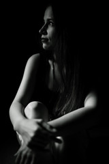 Studio portrait of a beautiful brunette on a black background