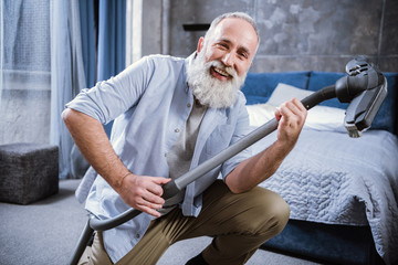 Man with vacuum cleaner