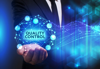 Business, Technology, Internet and network concept. Young businessman working on a virtual screen of the future and sees the inscription: Quality control