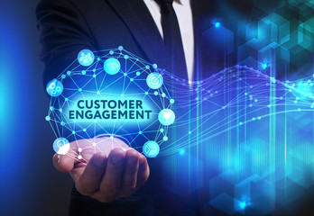 Business, Technology, Internet and network concept. Young businessman working on a virtual screen of the future and sees the inscription: Customer engagement