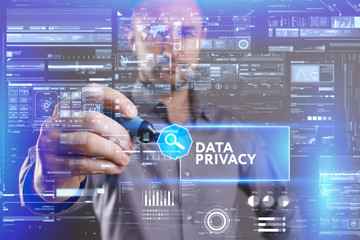 Business, Technology, Internet and network concept. Young businessman working on a virtual screen of the future and sees the inscription: Data privacy