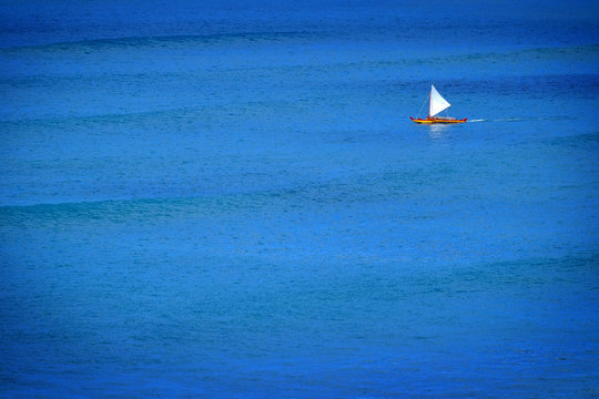 Sailboat Sailing on Calm Blue Ocean