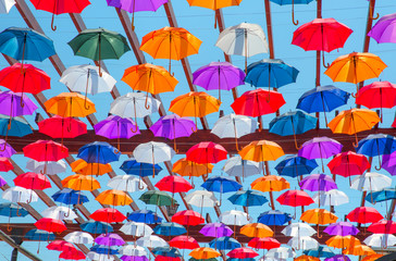 Fototapeta na wymiar A lot of multicolored umbrellas
