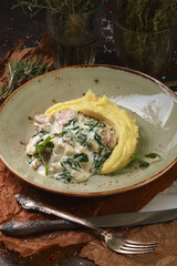 Mashed potatoes with meat sauce and spinach