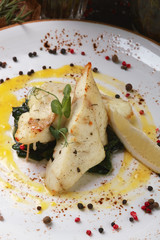 Seabass with vegetables with lemon and sauce