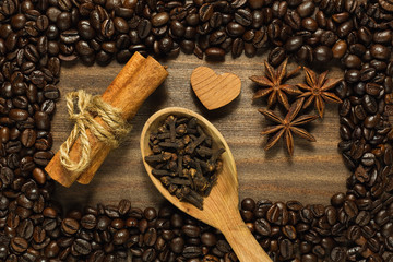 Spices framed by roasted coffee beans