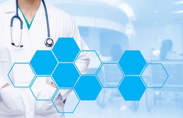 smart doctor with a stethoscope around his neck on the hospital blurred and blank hexagon shaped pattern design background, healthcare medical technology concept, copy space.